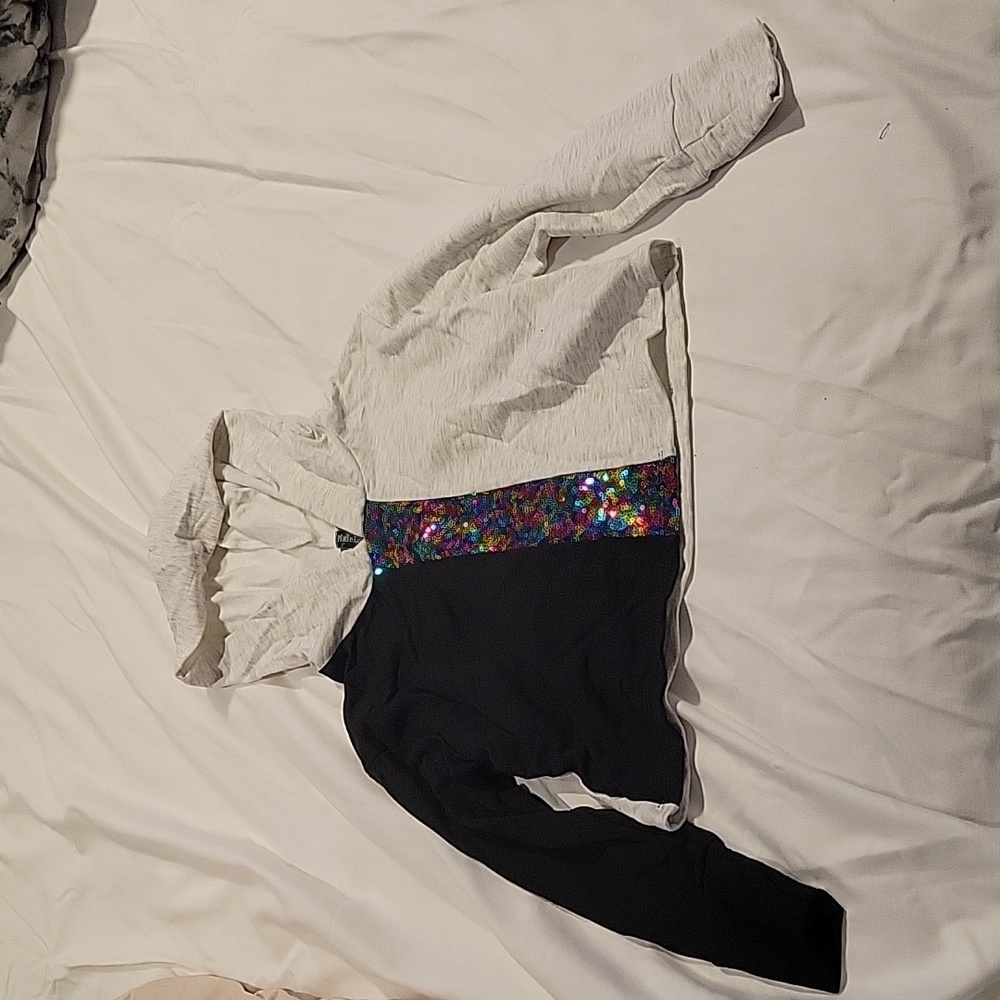 Never worn girls size 5 thin cropped hoodie with rainbow sequin stripe